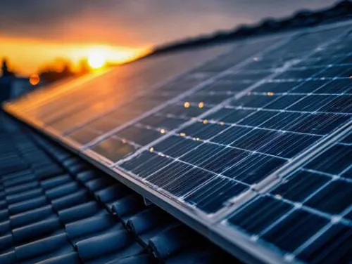 Solar panels glowing at sunset on a rooftop